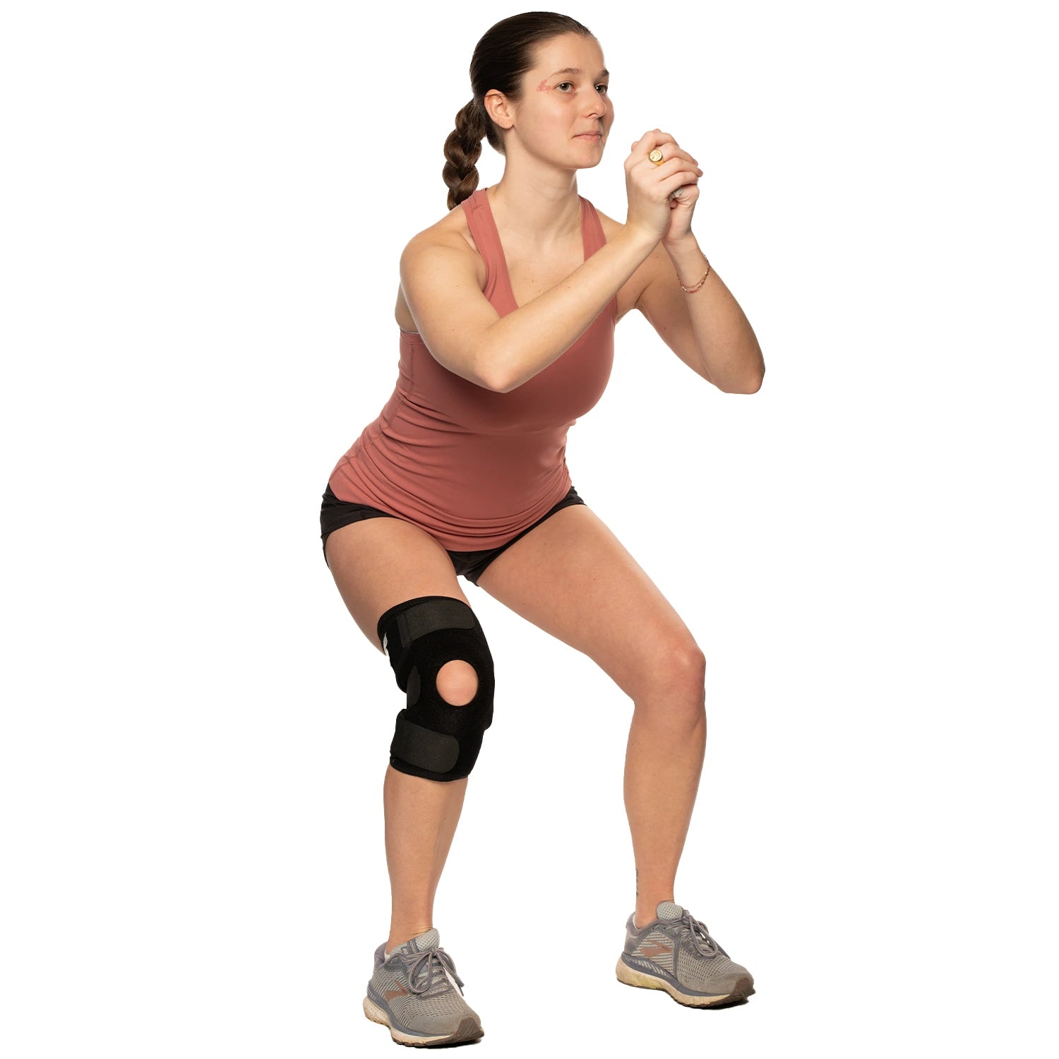 Woman working out while wearing a knee cap without hinge