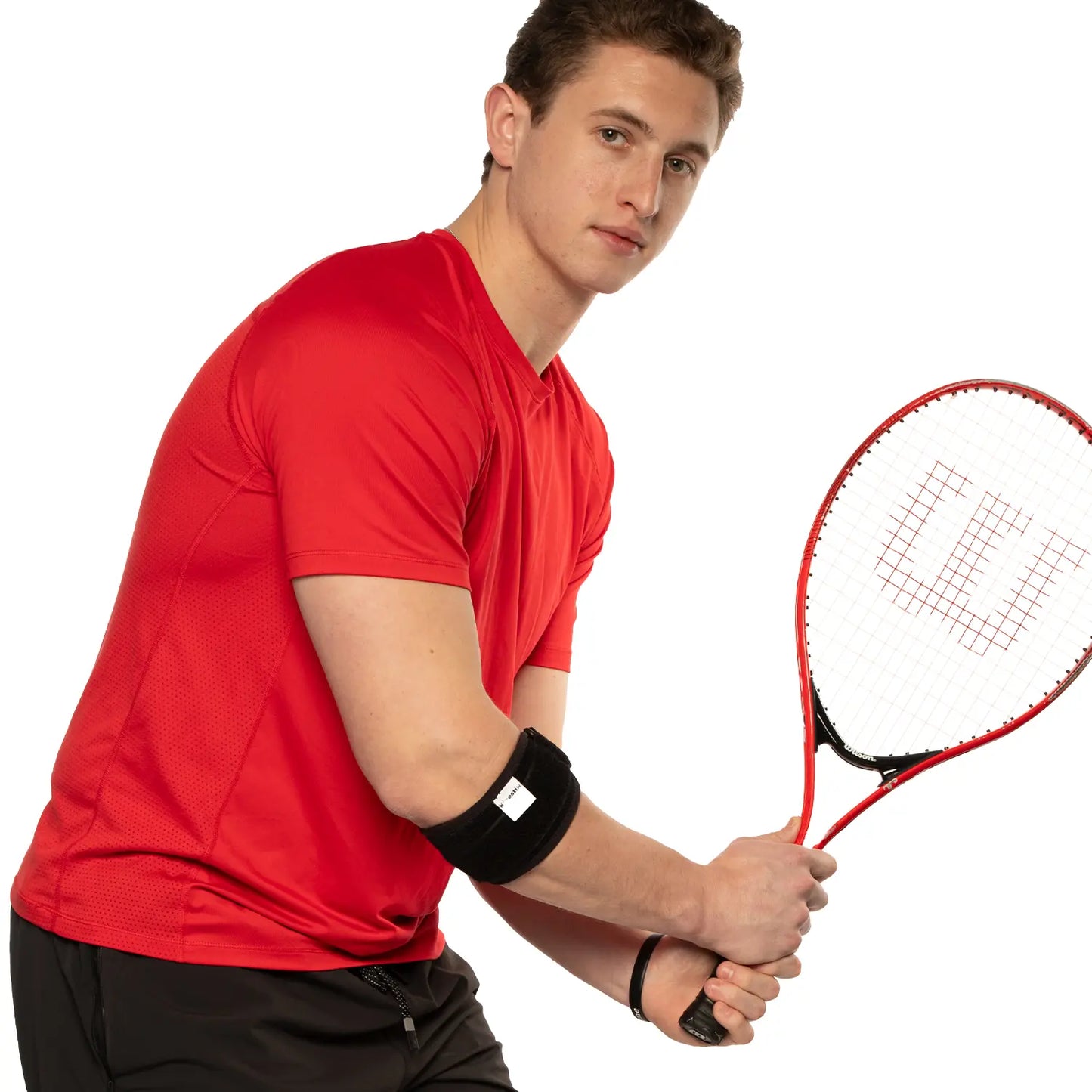 Man posing with a black tennis elbow brace