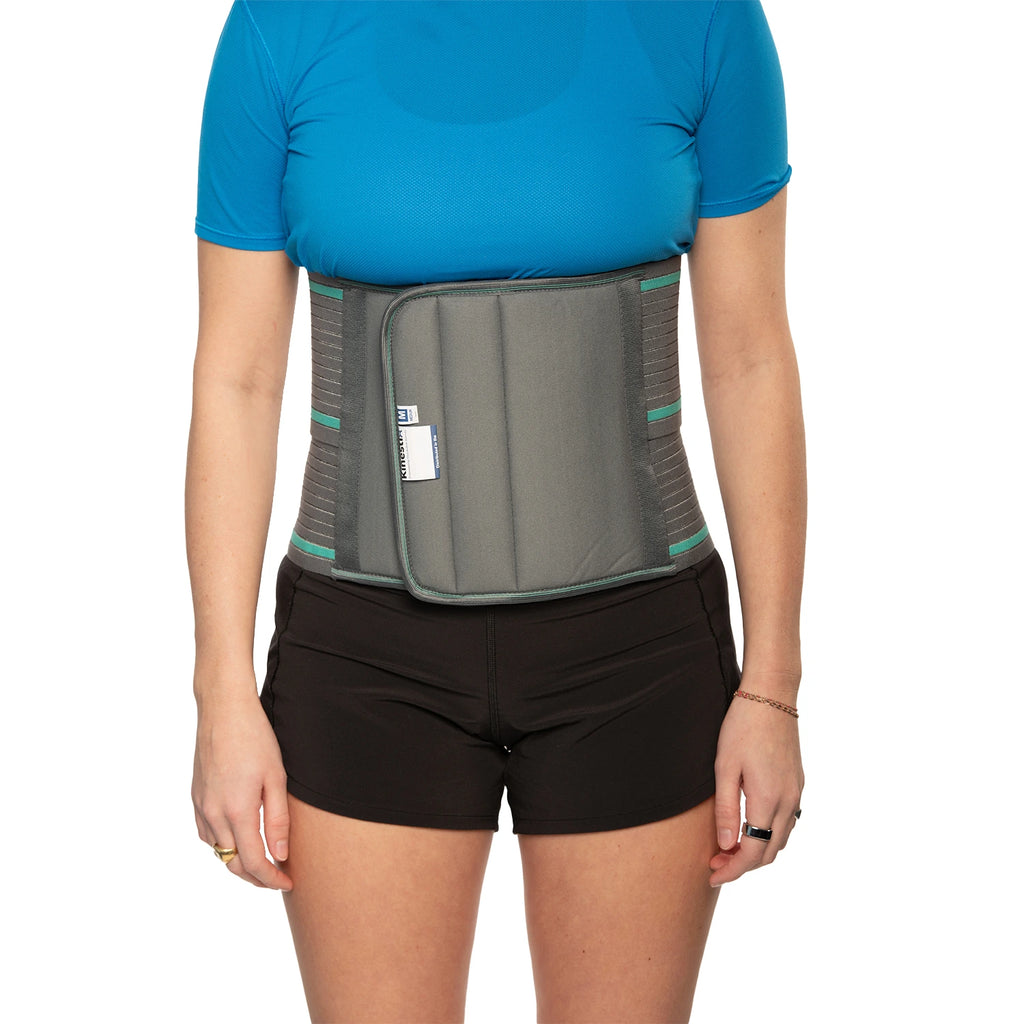Woman wearing an abdominal support belt