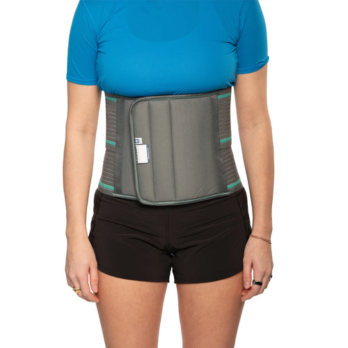 Woman wearing an abdominal support belt