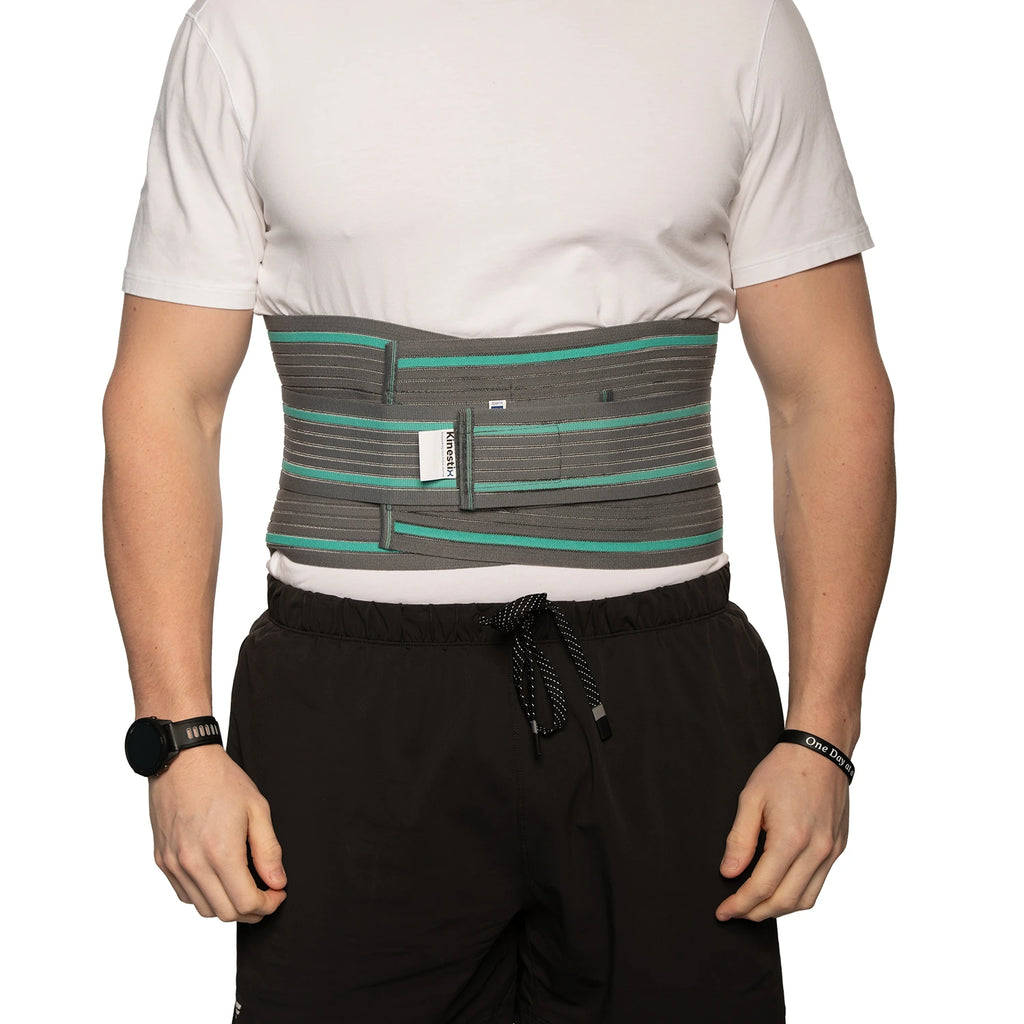 Man demonstrating the lumbar Sacro support belt				